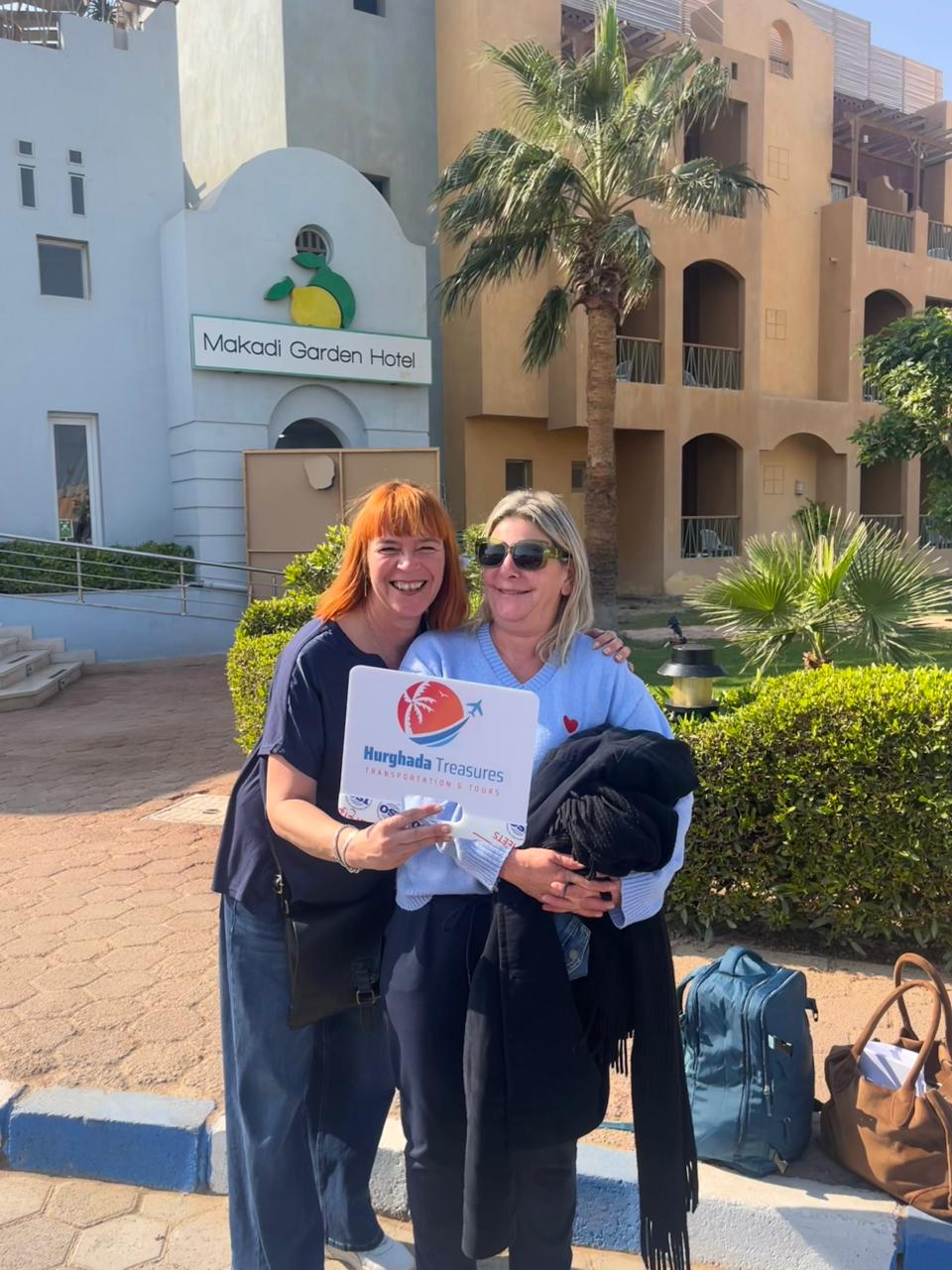 Two friends with the Hurghada Treasures sign at Makadi Garden Hotel